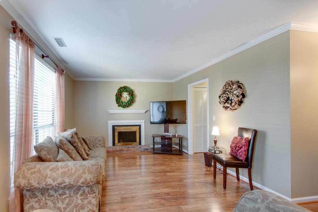 951 General George Patton Road Nashville, TN 37221 - Photo 9 of 25 a living room with furniture and a fireplace