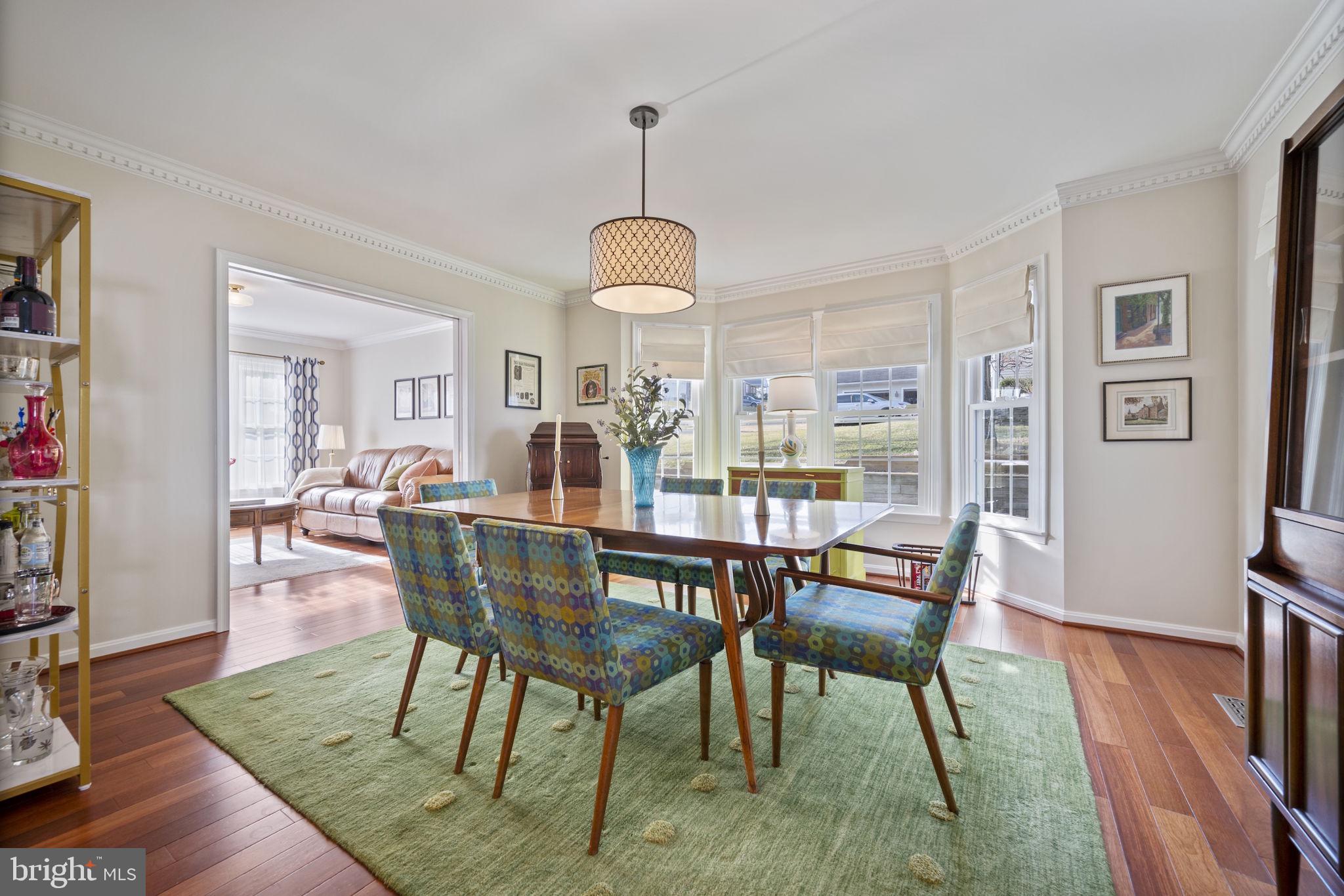 4310 Necker Avenue Nottingham, MD 21236 - Photo 11 of 56 a view of a dining room with furniture window and wooden floor