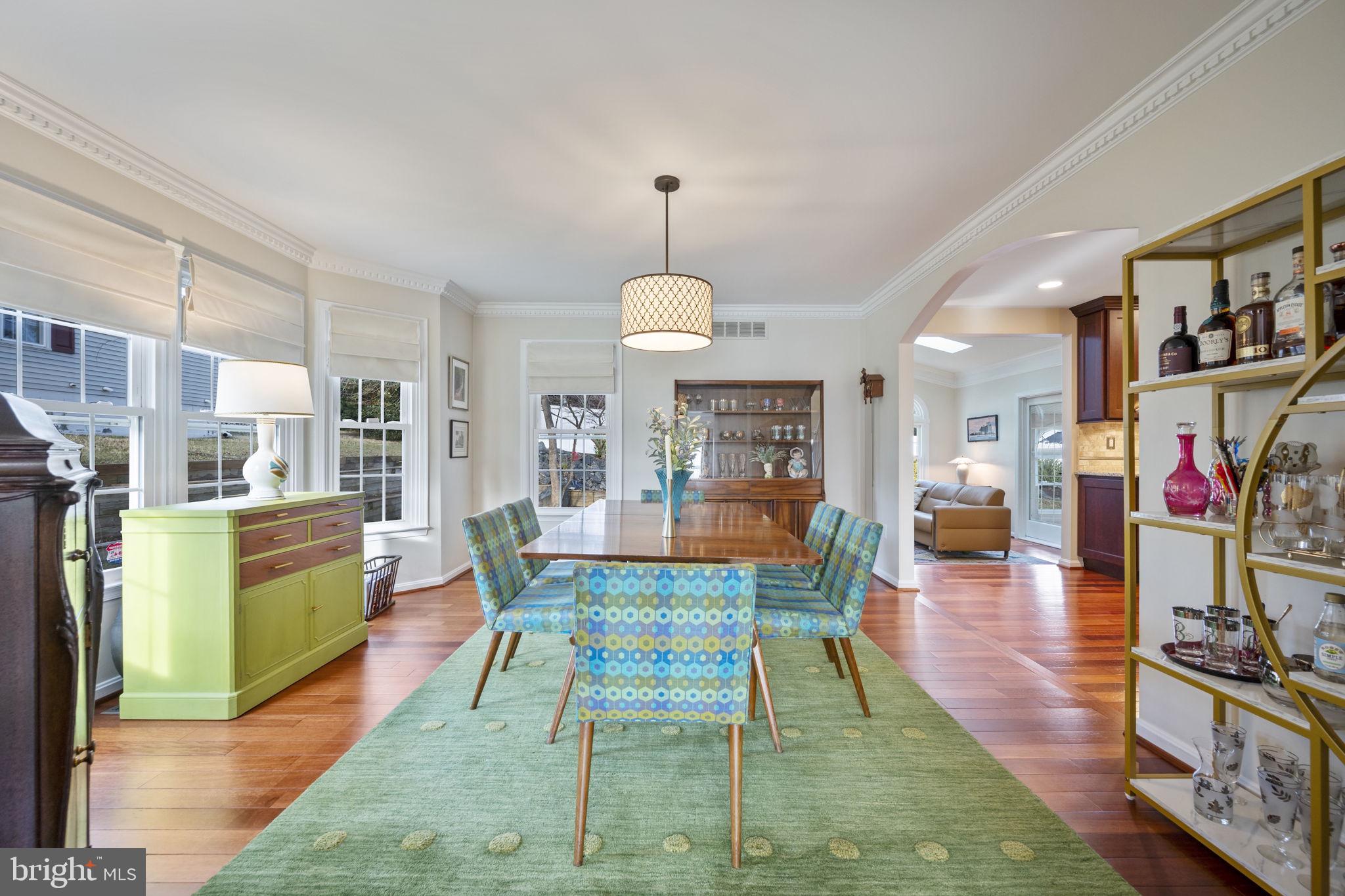 4310 Necker Avenue Nottingham, MD 21236 - Photo 56 of 56 a living room with furniture a dining table and a fireplace