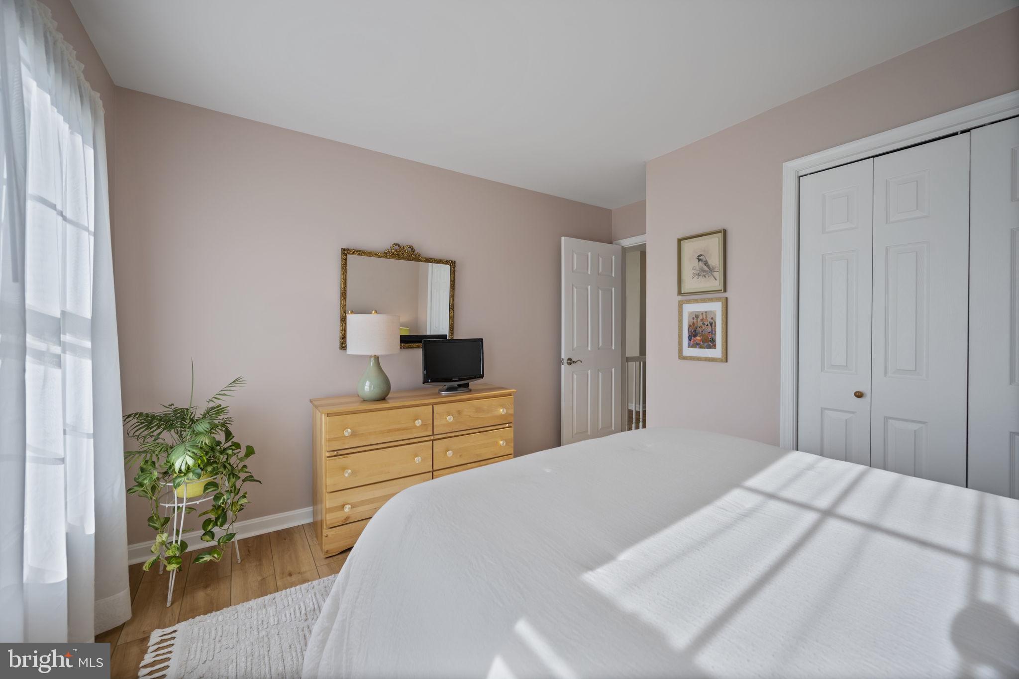 4310 Necker Avenue Nottingham, MD 21236 - Photo 32 of 56 a bedroom with a bed and a dresser in it