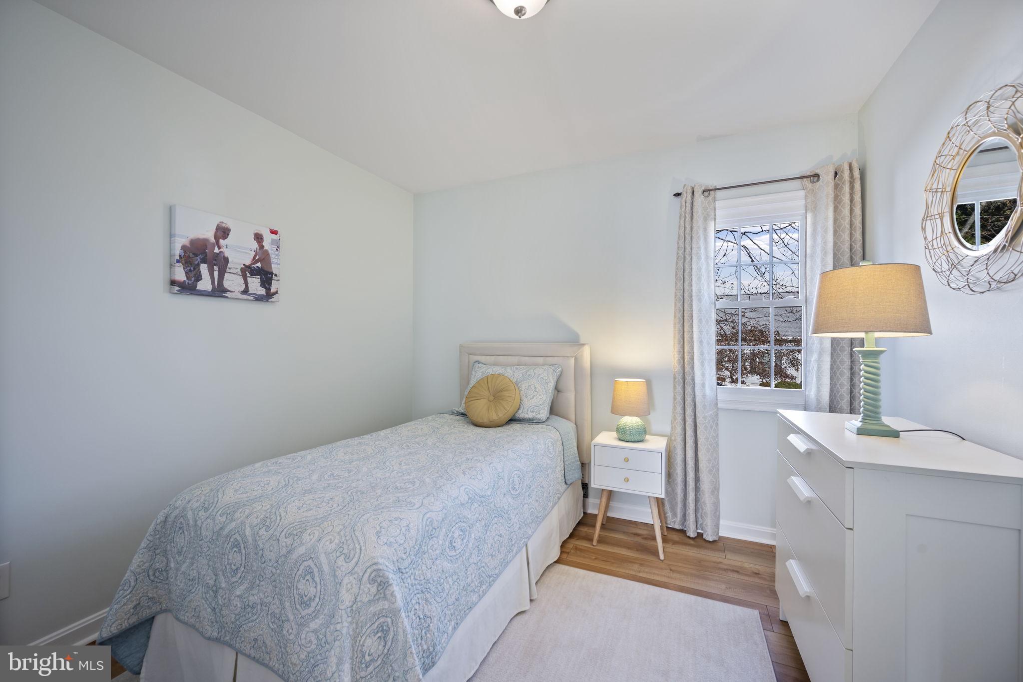 4310 Necker Avenue Nottingham, MD 21236 - Photo 33 of 56 a bedroom with a bed and a window