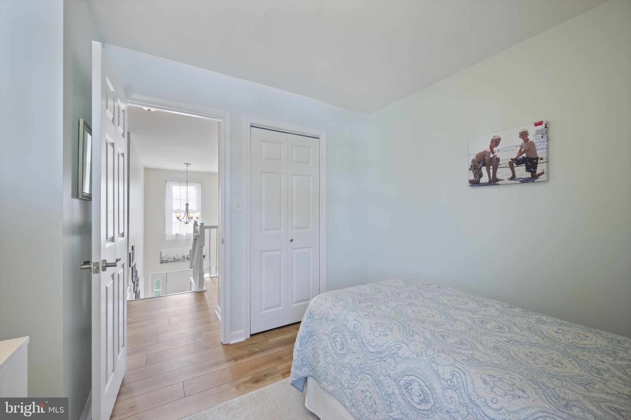 4310 Necker Avenue Nottingham, MD 21236 - Photo 34 of 56 a view of a hallway with wooden floor and a bathroom