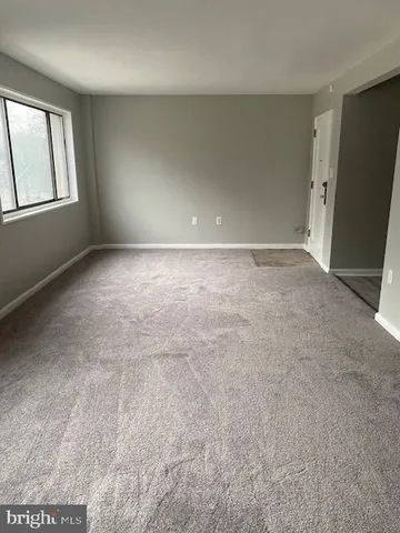 a kitchen with stainless steel appliances a refrigerator sink and white cabinets