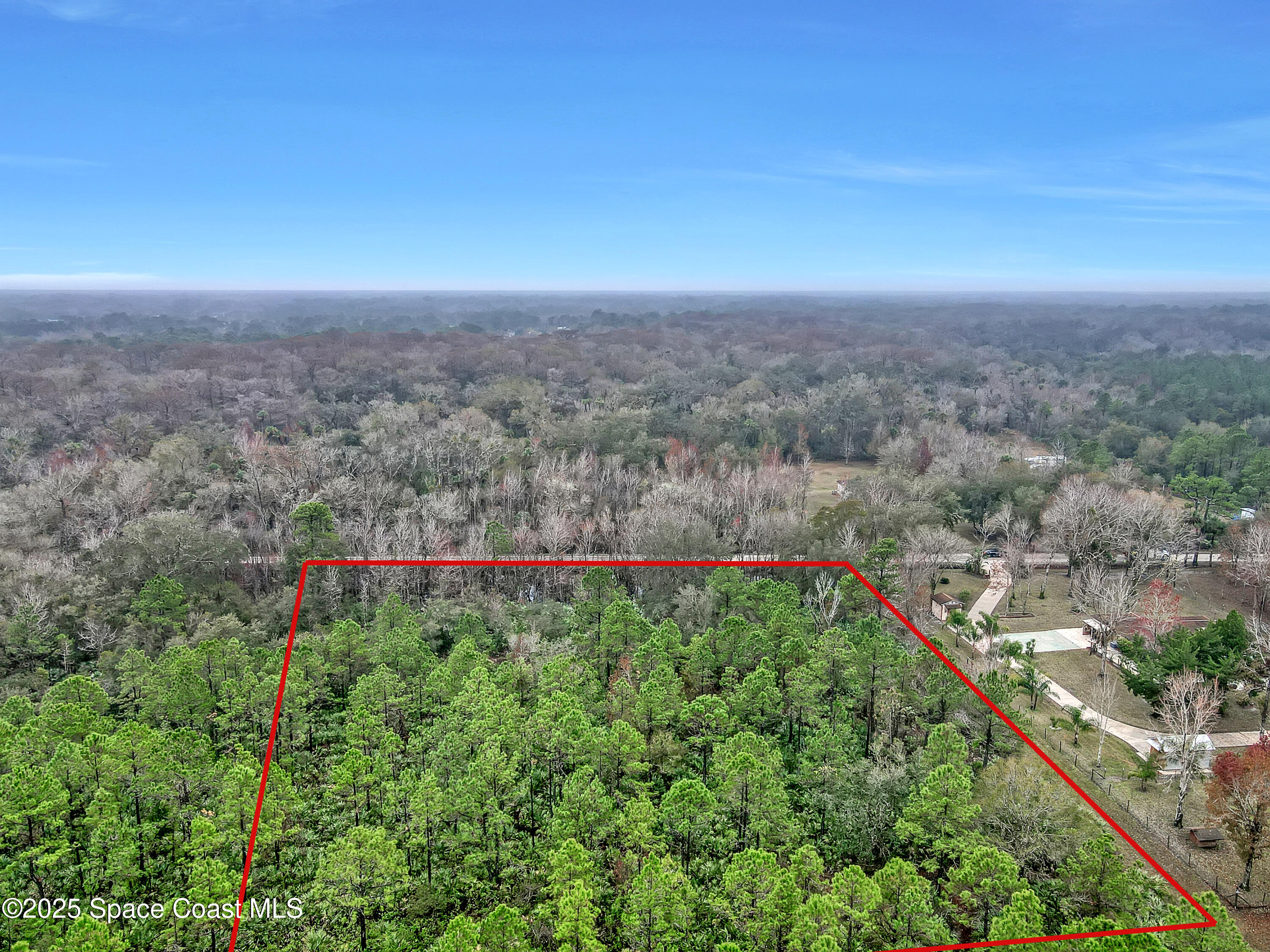 4740 Lloyd Street Mims, FL 32754 - Photo 4 of 6 a view of a field with an ocean