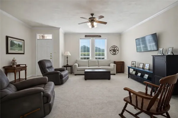 a living room with furniture and a window