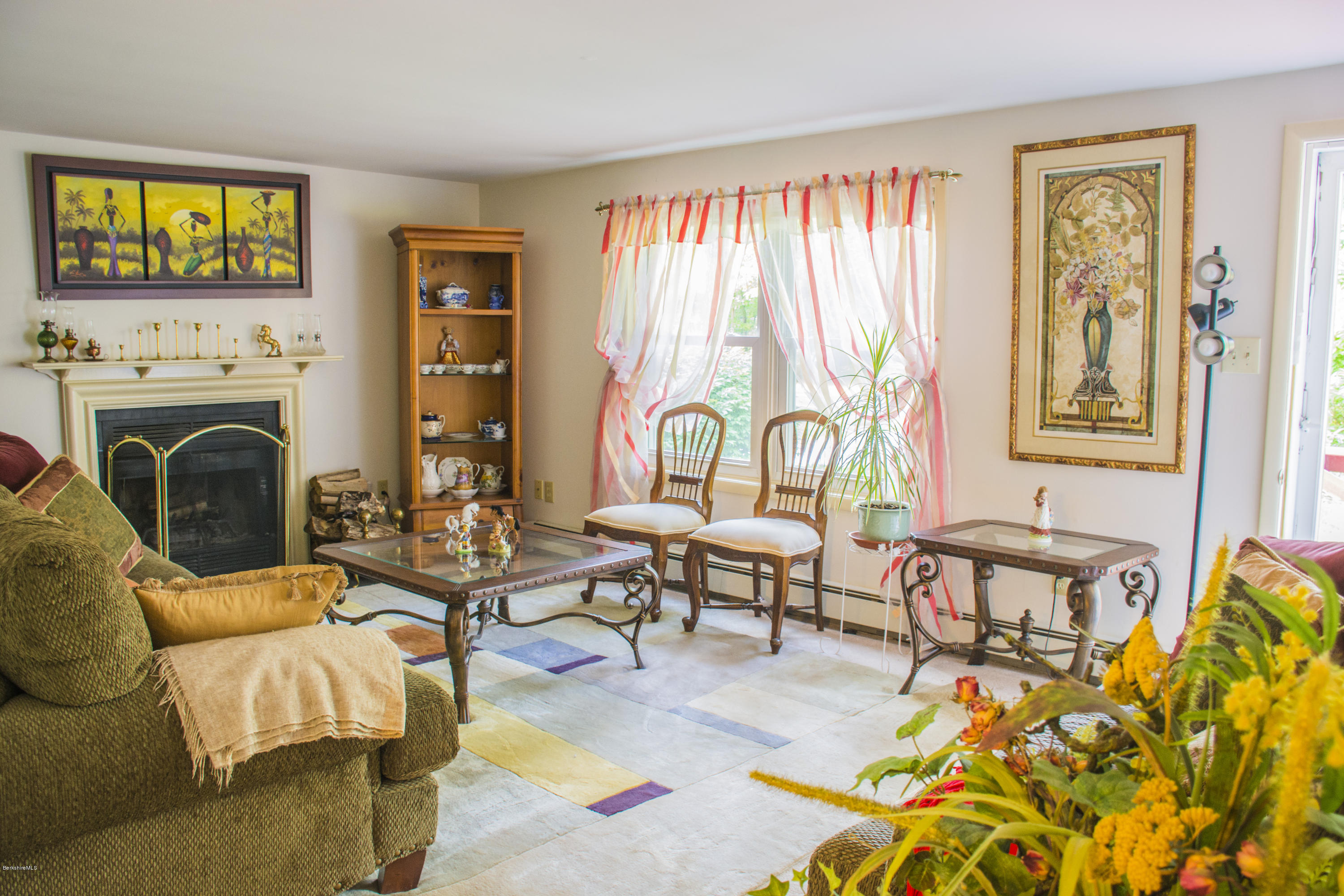 654 Clayton Road Sheffield, MA 01222 - Photo 3 of 20 a living room with fireplace furniture and a window