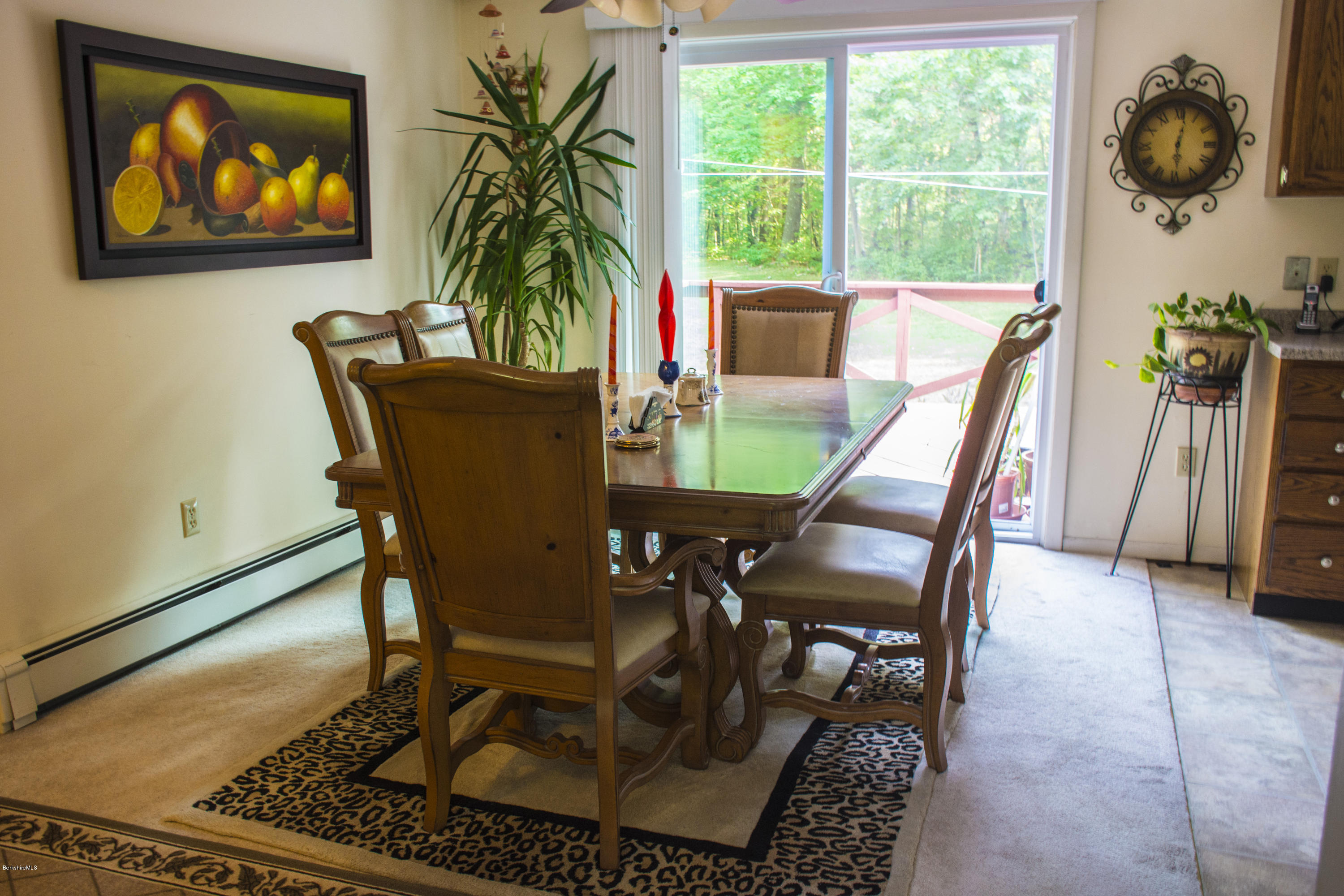 654 Clayton Road Sheffield, MA 01222 - Photo 4 of 20 a view of a dining room with furniture window and flowerpot
