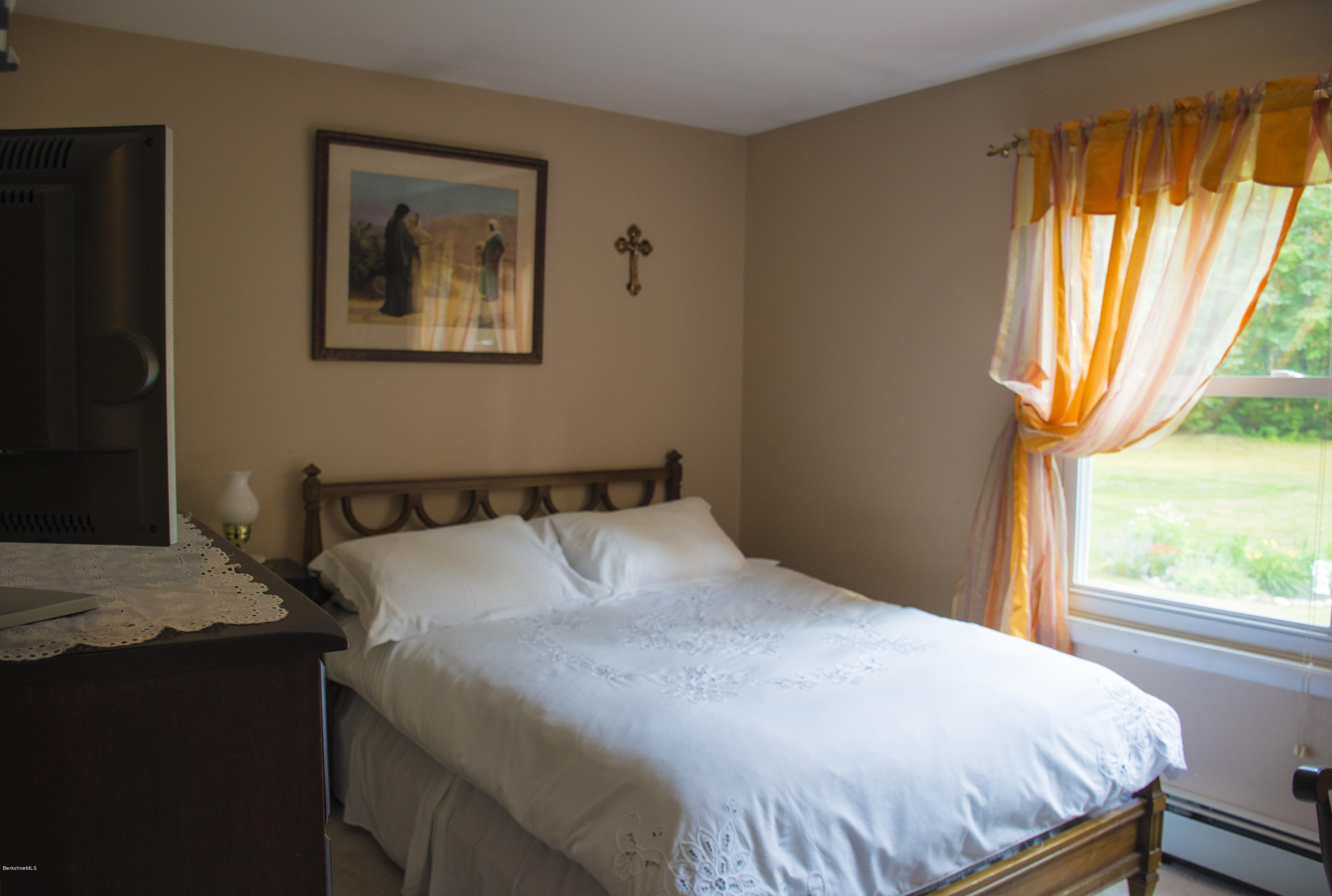 654 Clayton Road Sheffield, MA 01222 - Photo 8 of 20 a bedroom with a bed and a window
