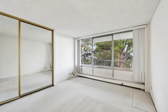 a view of empty room with floor to ceiling window