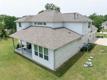a aerial view of a house with a yard