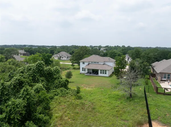 an aerial view of residential house with outdoor space