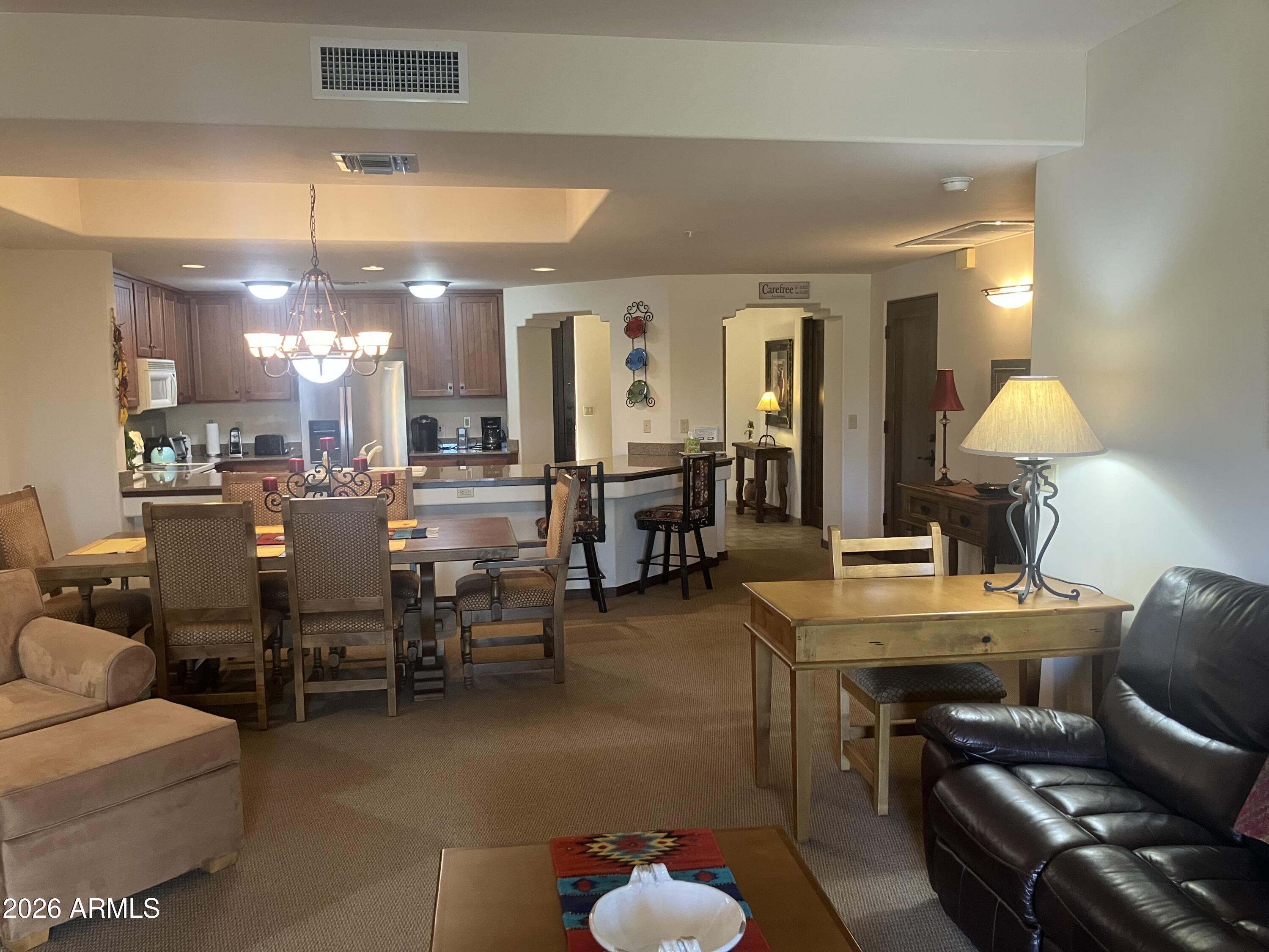 36601 North Mule Train Road, Unit 15A Carefree, AZ 85377 - Photo 15 of 31 Living Room to Kitchen