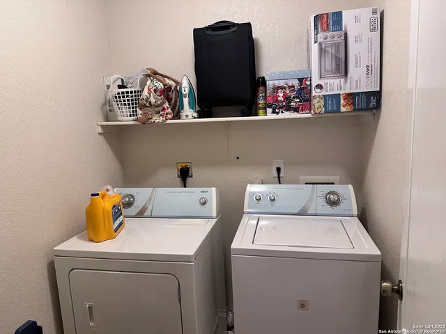 a bathroom with a sink a toilet and shower curtain