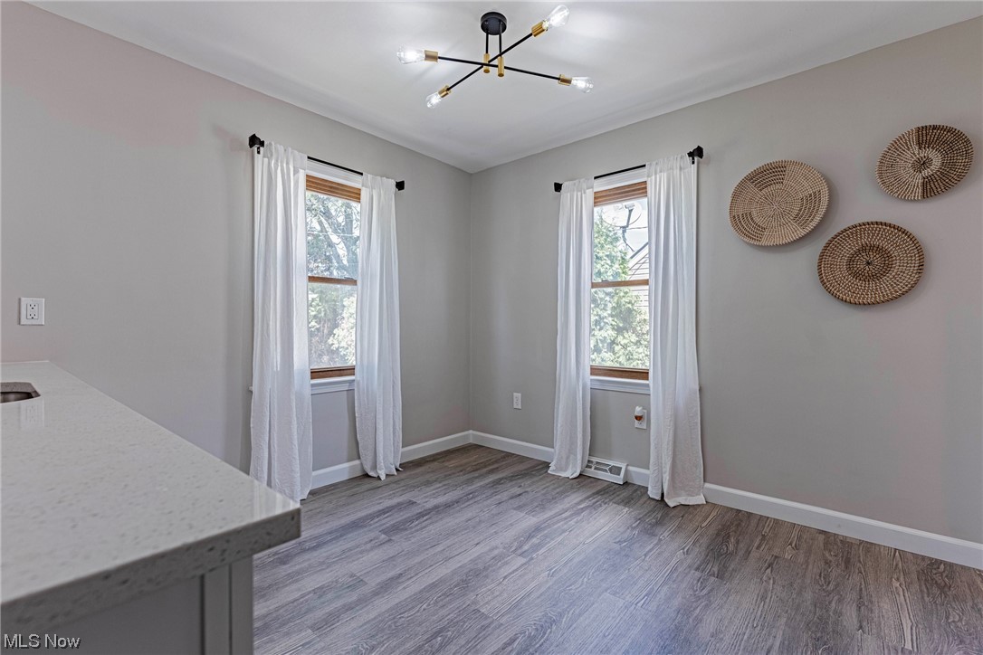 11815 Derby Road Garfield Heights, OH 44125 - Photo 11 of 31 lLVP flooring with a healthy amount sunlight