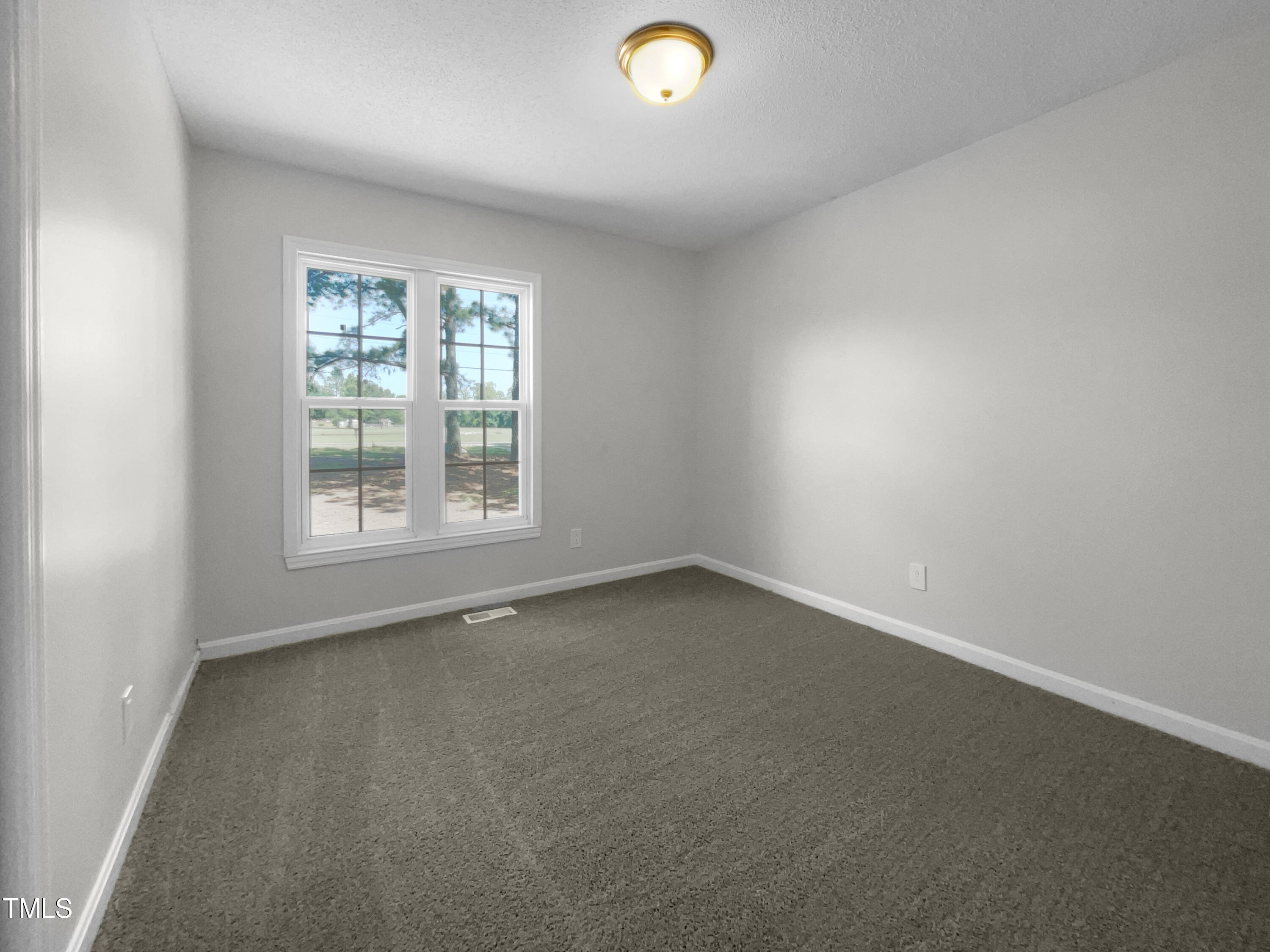 1516 Clayton Road Fuquay-Varina, NC 27526 - Photo 11 of 17 an empty room with a window