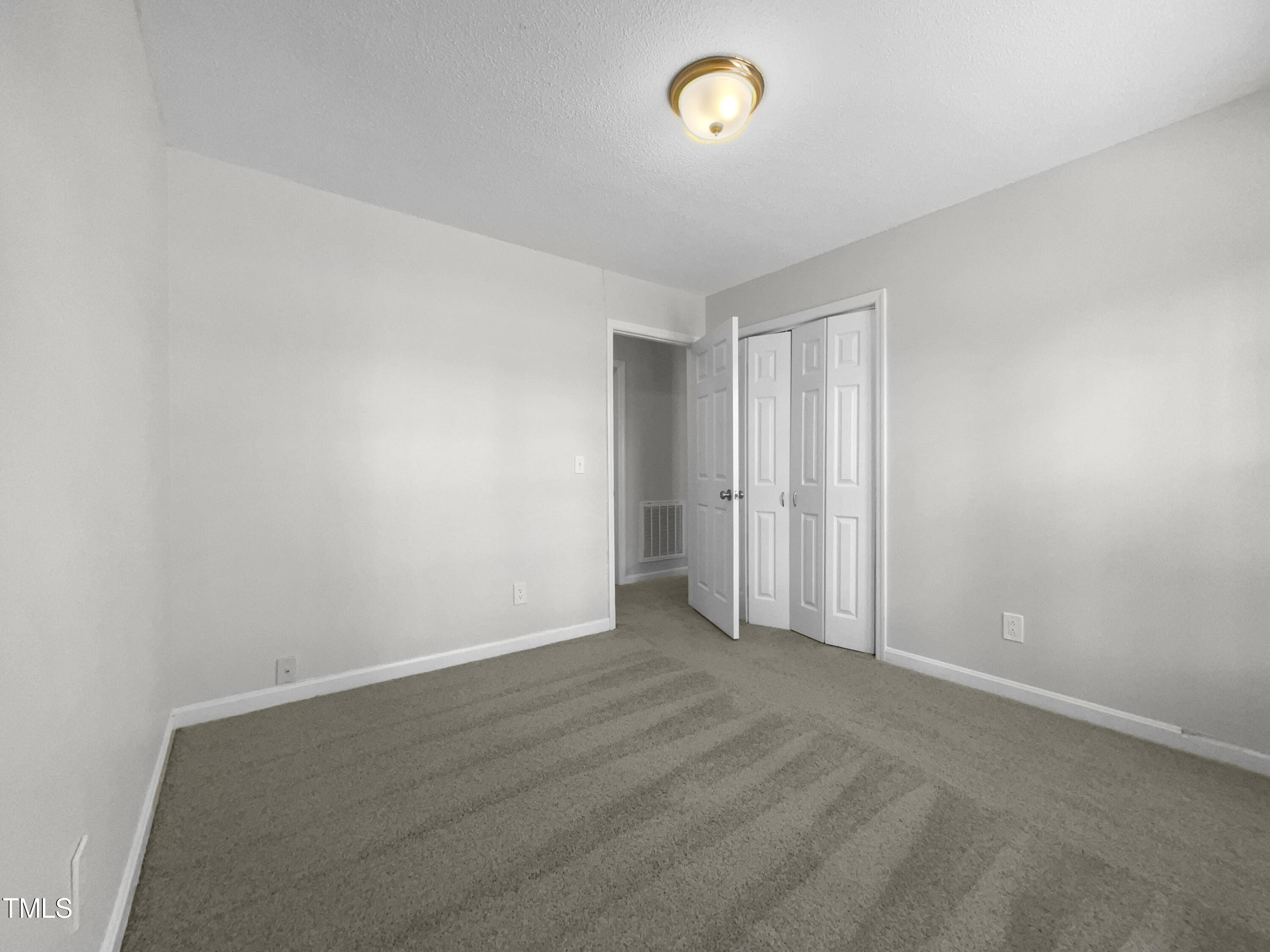 1516 Clayton Road Fuquay-Varina, NC 27526 - Photo 12 of 17 an empty room with a empty space and window