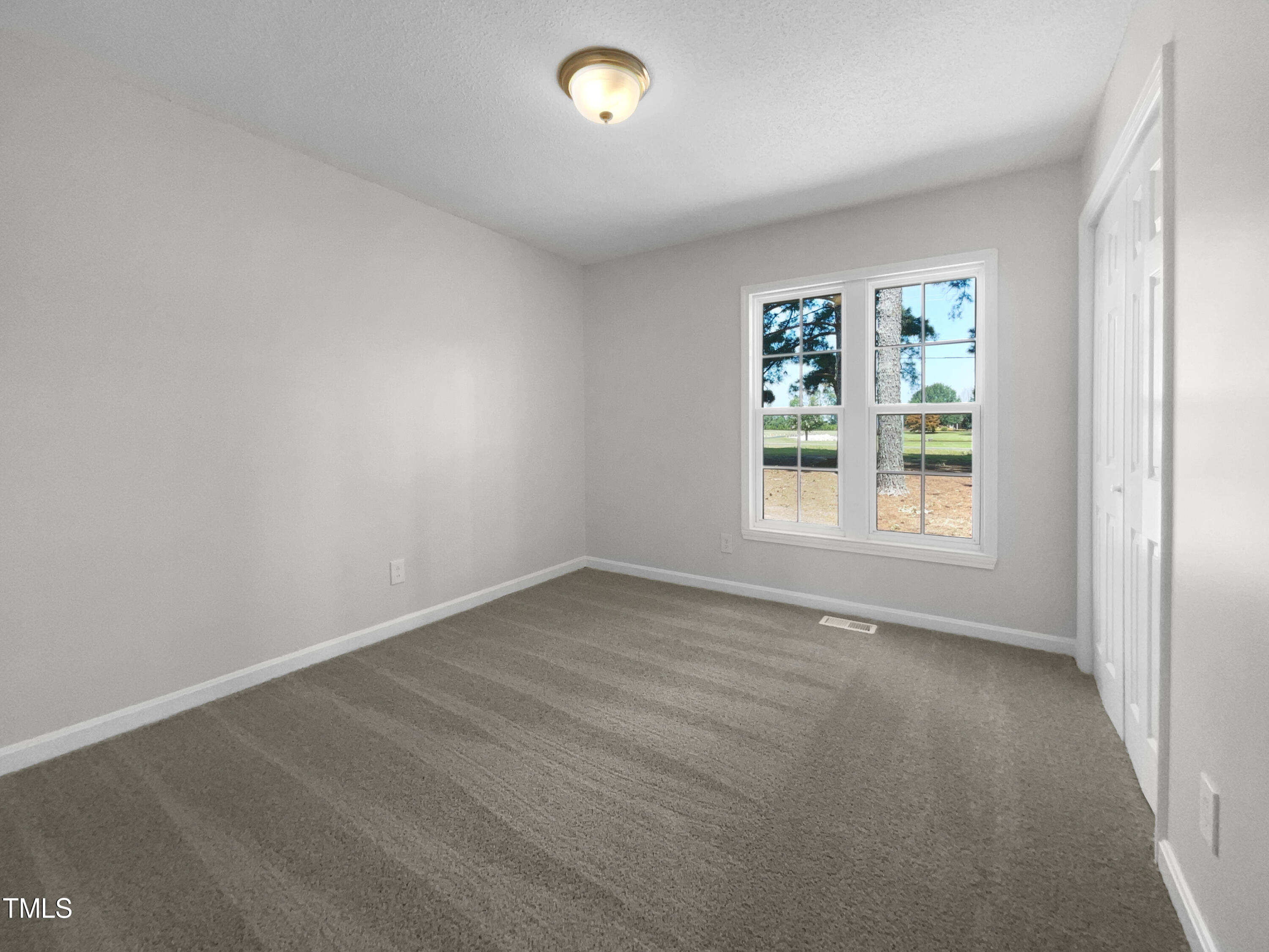 1516 Clayton Road Fuquay-Varina, NC 27526 - Photo 13 of 17 an empty room with a window