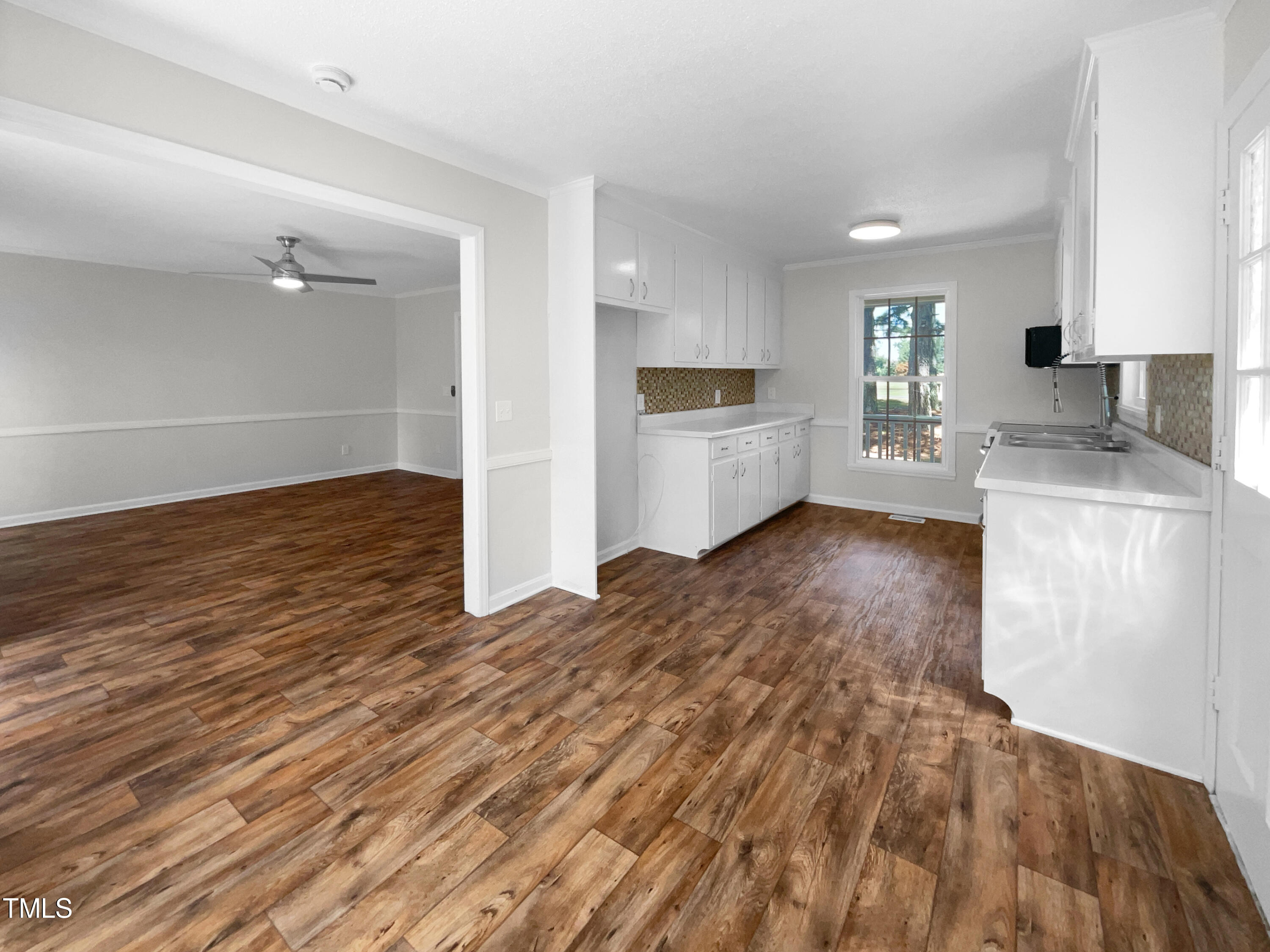 1516 Clayton Road Fuquay-Varina, NC 27526 - Photo 10 of 17 a kitchen with granite countertop a sink and a stove top oven