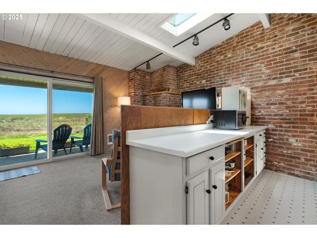 a kitchen with a stove and a kitchen island
