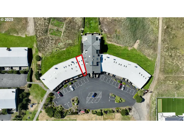 an aerial view of a house with a garden