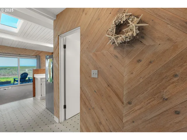 a view of a livingroom with furniture and front door