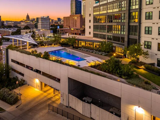 a room with gym equipment and large windows
