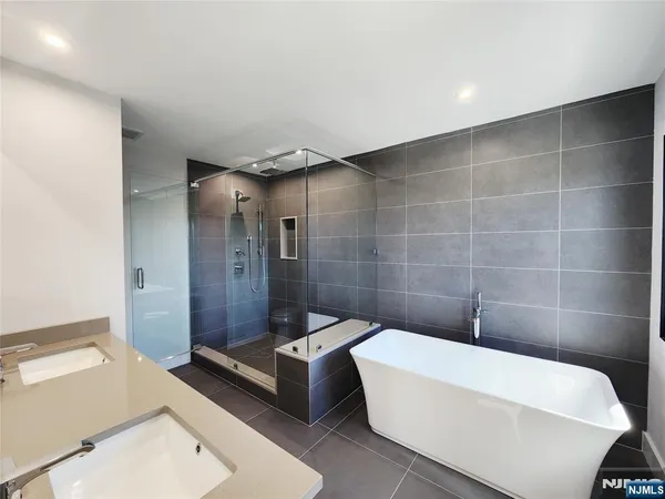 a bathroom with a bathtub and sink