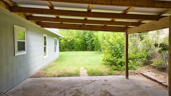 a view of a backyard with a garden