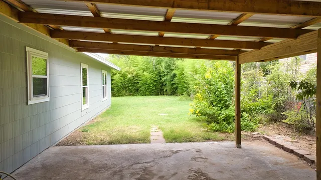 a view of a backyard with a garden