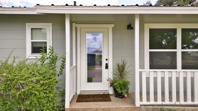a view of a house with a small yard