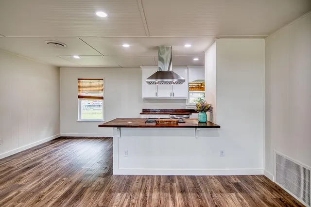 a kitchen with a stove and cabinets