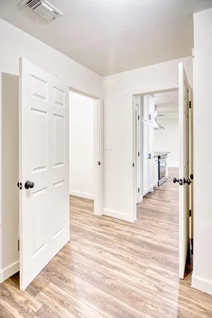 a spacious bathroom with a sink and a mirror