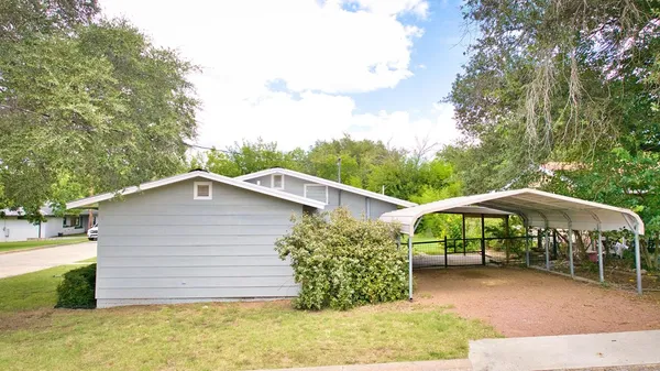 a house with trees in front of it