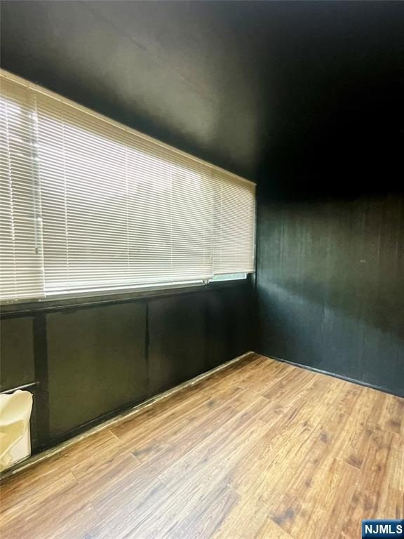 90 Prospect Avenue, Unit 2B Hackensack, NJ 07601 - Photo 7 of 15 a view of empty room with wooden floor