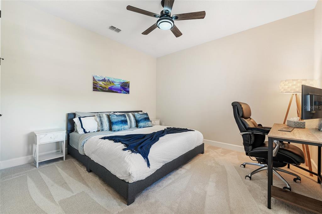 10175 Brocksport Circle Gotha, FL 34734 - Photo 40 of 54 a bedroom with a bed and a desk
