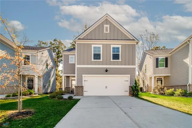 front view of a house with a yard