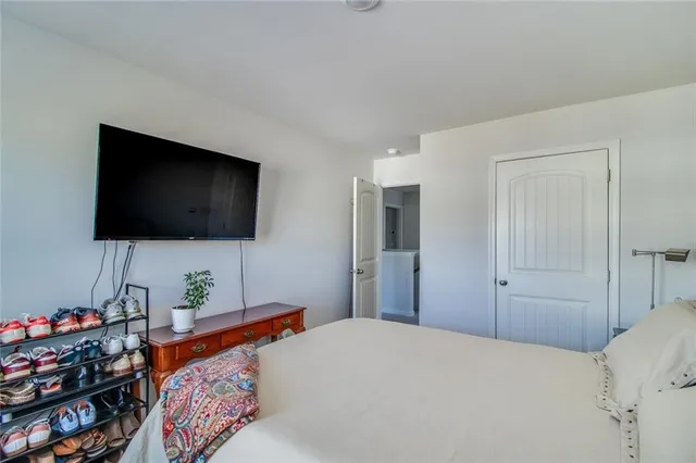 a view of a patio with table and chairs and potted plants