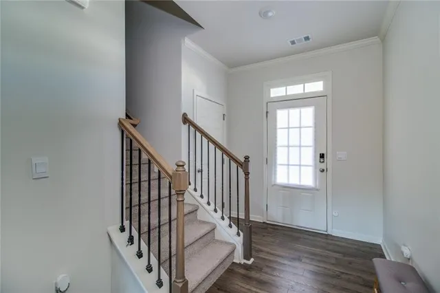 a kitchen with stainless steel appliances kitchen island granite countertop a stove a sink and a microwave