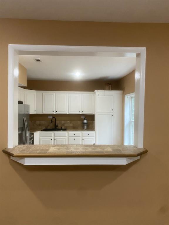 1624 Longmont Drive Lawrenceville, GA 30044 - Photo 6 of 17 a kitchen with a sink and a dishwasher with wooden floor