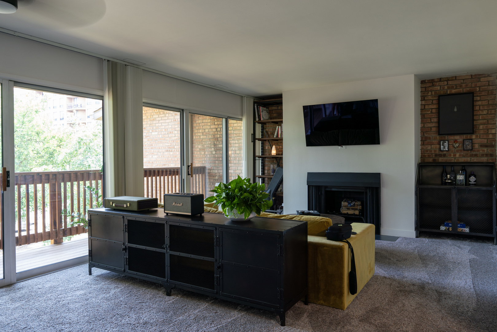 5880 Forest View Road, Unit F Lisle, IL 60532 - Photo 3 of 39 a living room with furniture a flat screen tv and a fireplace