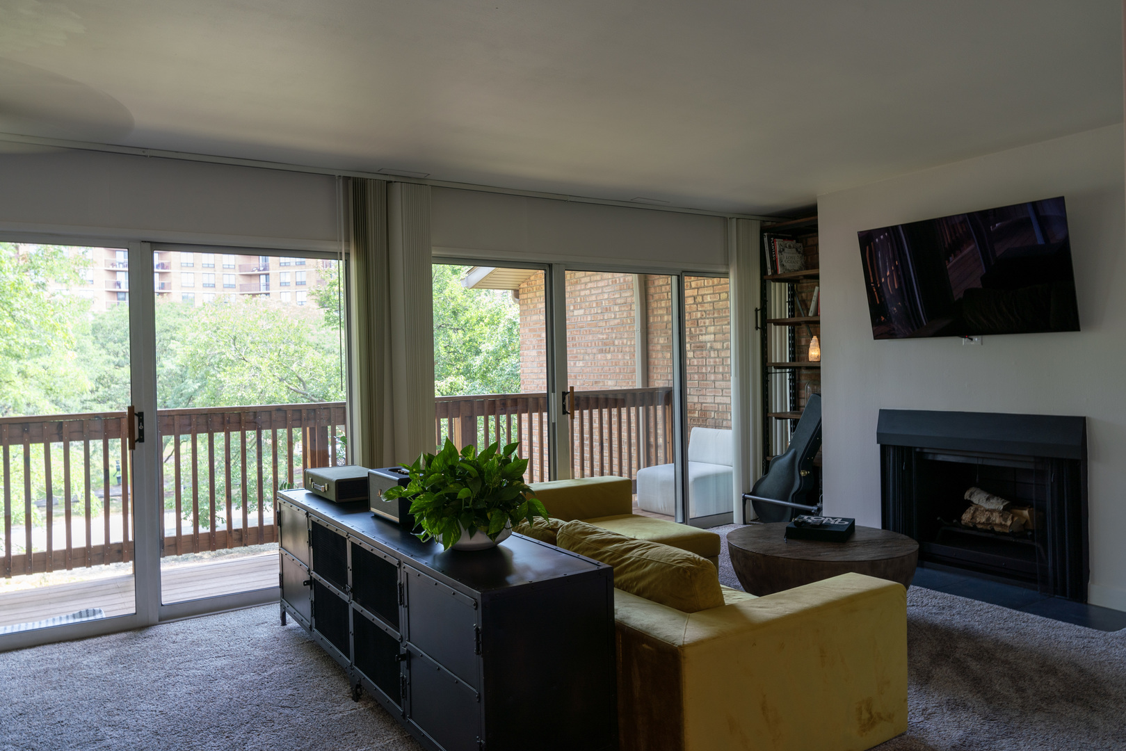 5880 Forest View Road, Unit F Lisle, IL 60532 - Photo 4 of 39 a living room with furniture a flat screen tv and a fireplace