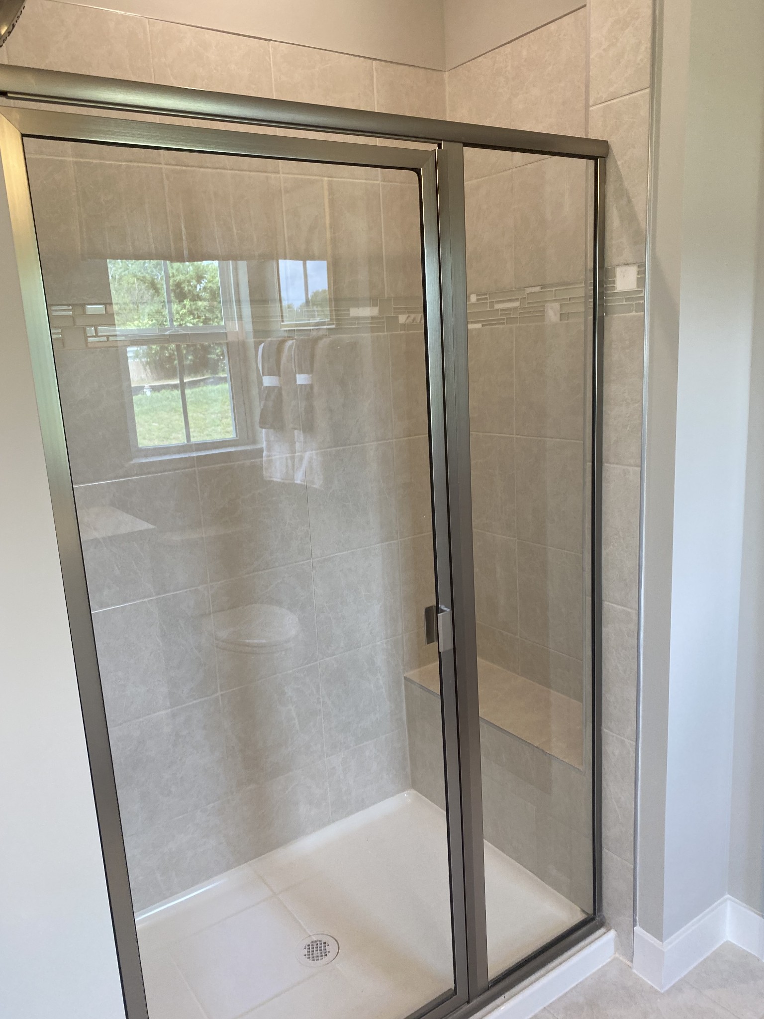101 Keelon Gap Road, Unit 180D Spring Hill, TN 37174 - Photo 8 of 13 a bathroom with a glass shower door