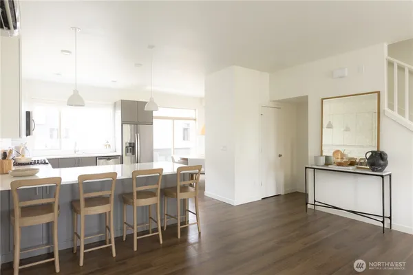 a kitchen with a sink stove and microwave