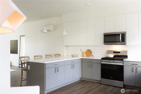 a kitchen with a sink cabinets and appliances