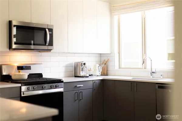 a kitchen with a sink and cabinets