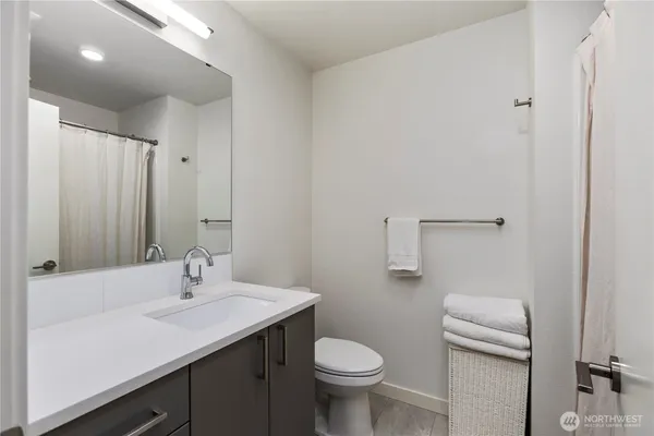 a view of a hallway with a door and staircase