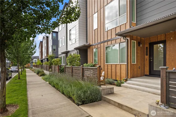 a view of a patio with couches and a fire pit