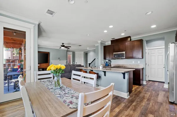 a living room with fireplace furniture and a flat screen tv
