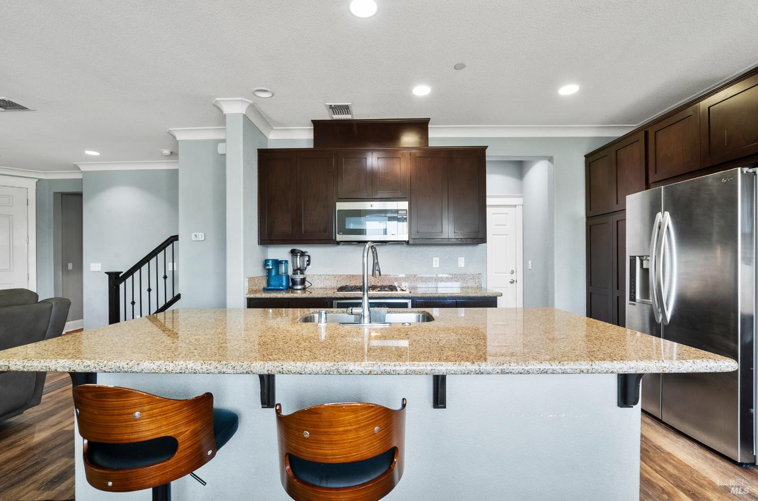 5311 Gramercy Circle Fairfield, CA 94533 - Photo 12 of 43 a kitchen with stainless steel appliances granite countertop a sink a stove and a refrigerator