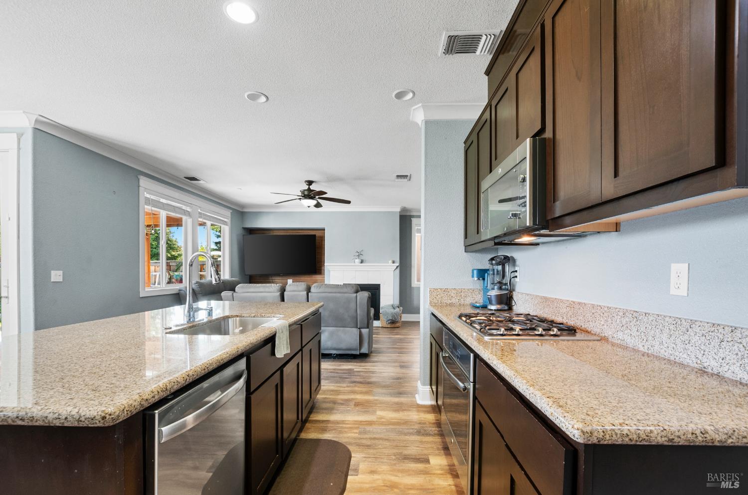 5311 Gramercy Circle Fairfield, CA 94533 - Photo 14 of 43 a kitchen with a sink stove and cabinets